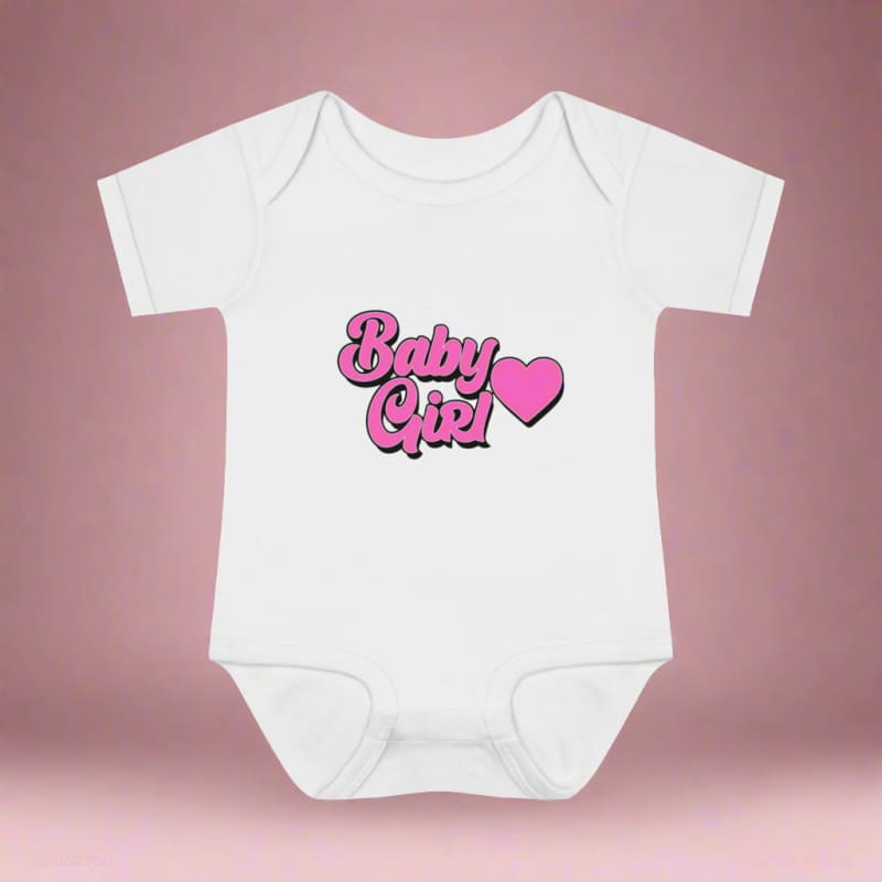 White baby onesie with ’Baby Girl’ and a pink heart printed on the front.