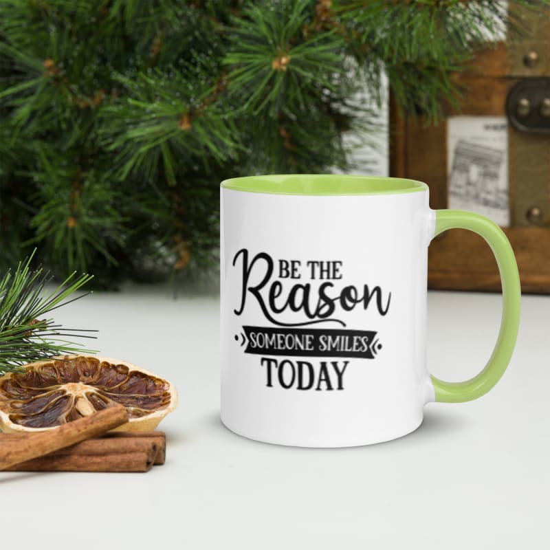 Coffee mug with an inspirational message and green interior.