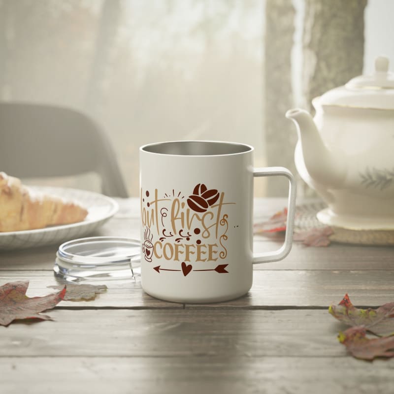 White coffee mug with decorative coffee-themed design.