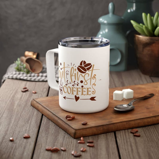 White coffee mug with decorative coffee-themed design in brown and gold tones.