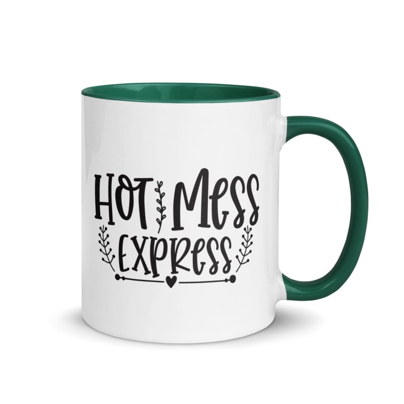 White ceramic mug with green interior and handle, featuring black text reading ’Hot Mess Express’.