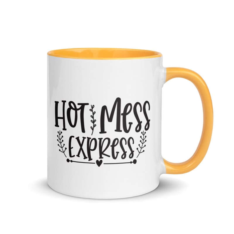 White ceramic mug with yellow interior and handle, featuring black text reading ’Hot Mess Express’.