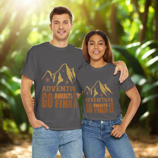 Matching gray t-shirts with a mountain design and ’Adventure Awaits’ text worn by a smiling couple.