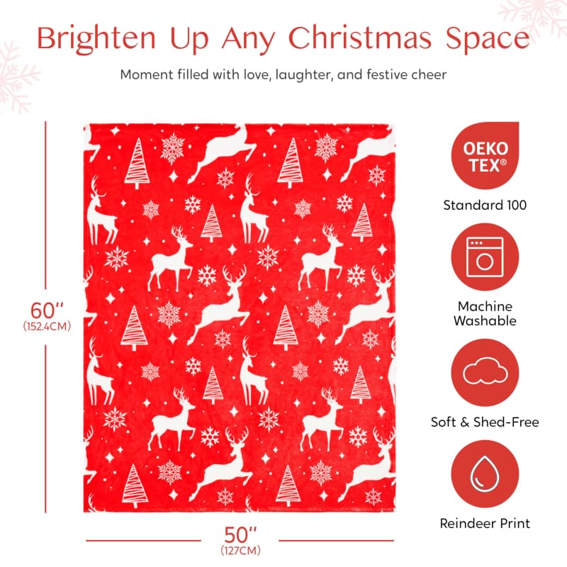 Red fabric with white reindeer and Christmas tree pattern.