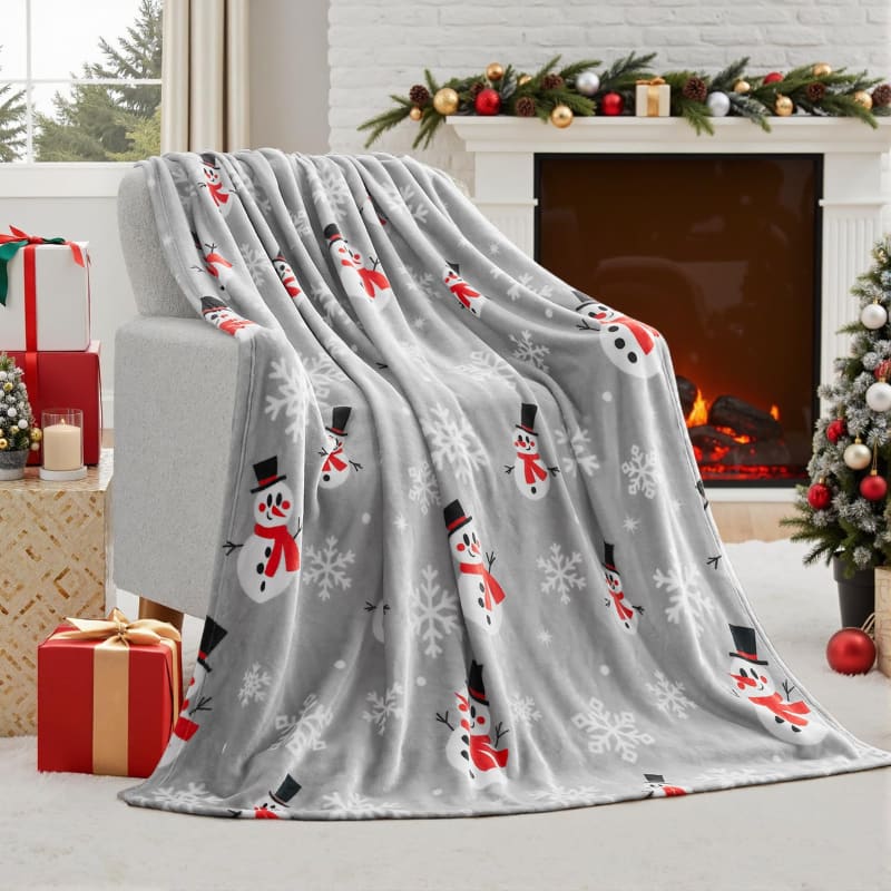 Soft gray throw blanket with snowman and snowflake pattern.