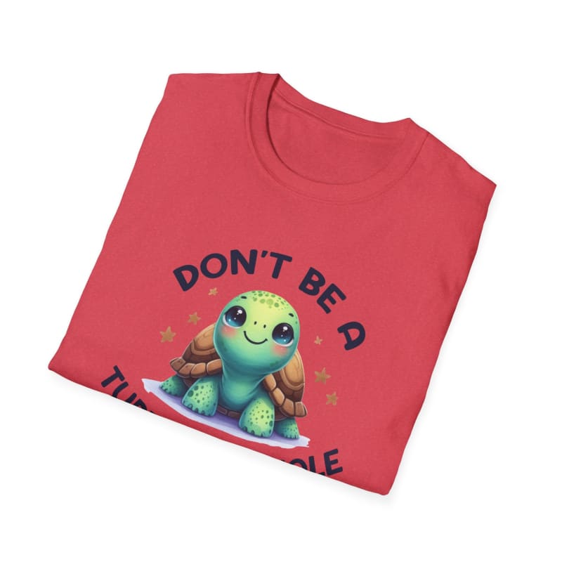 Folded red t-shirt with a cute cartoon turtle design and text.