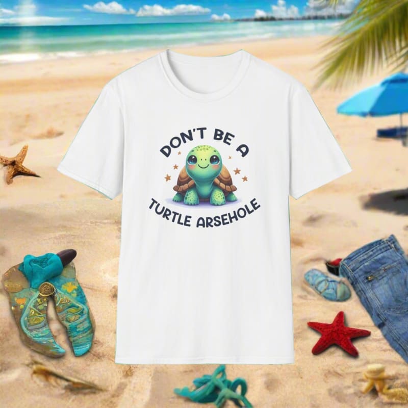 White t-shirt with a cute cartoon turtle design and text reading ’Don’t be a turtle arsehole’