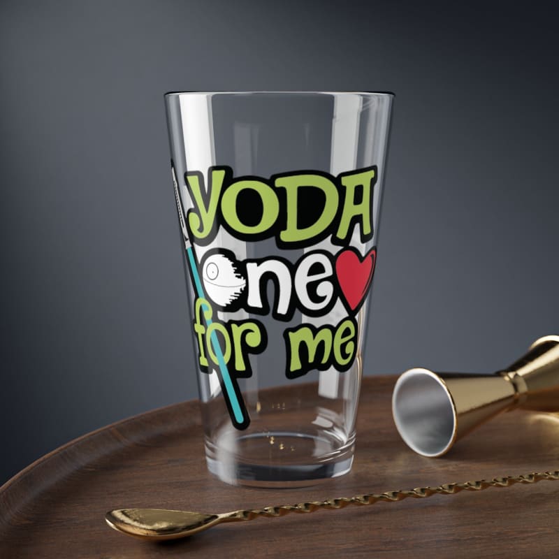 Glass drinking cup with colorful ’Yoda one for me’ text printed on it.