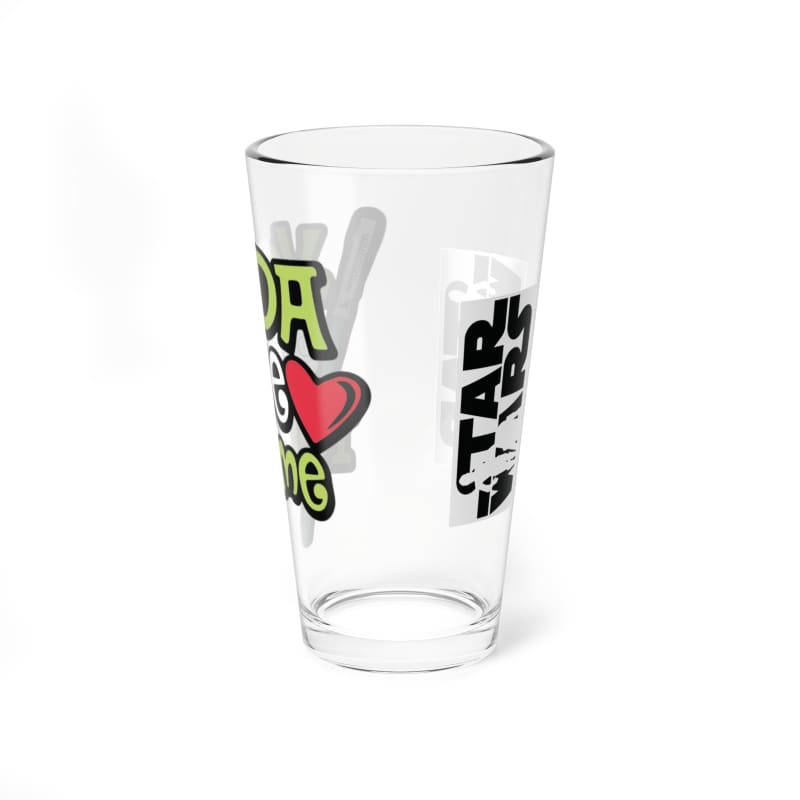 Clear glass drinking cup with colorful printed text and designs.