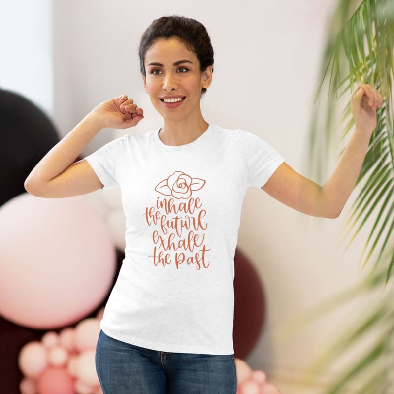 White t-shirt with a motivational phrase printed in pink lettering.