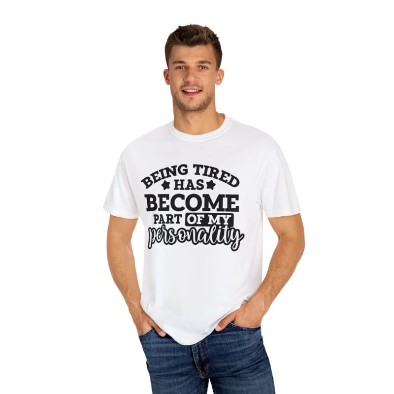 White t-shirt with black text saying ’BEING TIRED HAS BECOME PART OF MY PERSONALITY’.