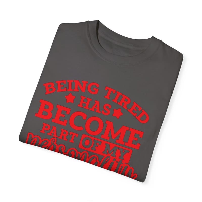 Gray t-shirt with red text about being tired becoming part of one’s personality.