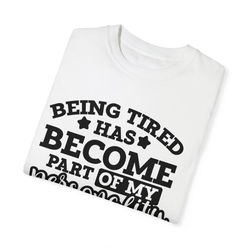 White t-shirt with black text saying ’BEING TIRED HAS BECOME PART OF MY PERSONALITY’.