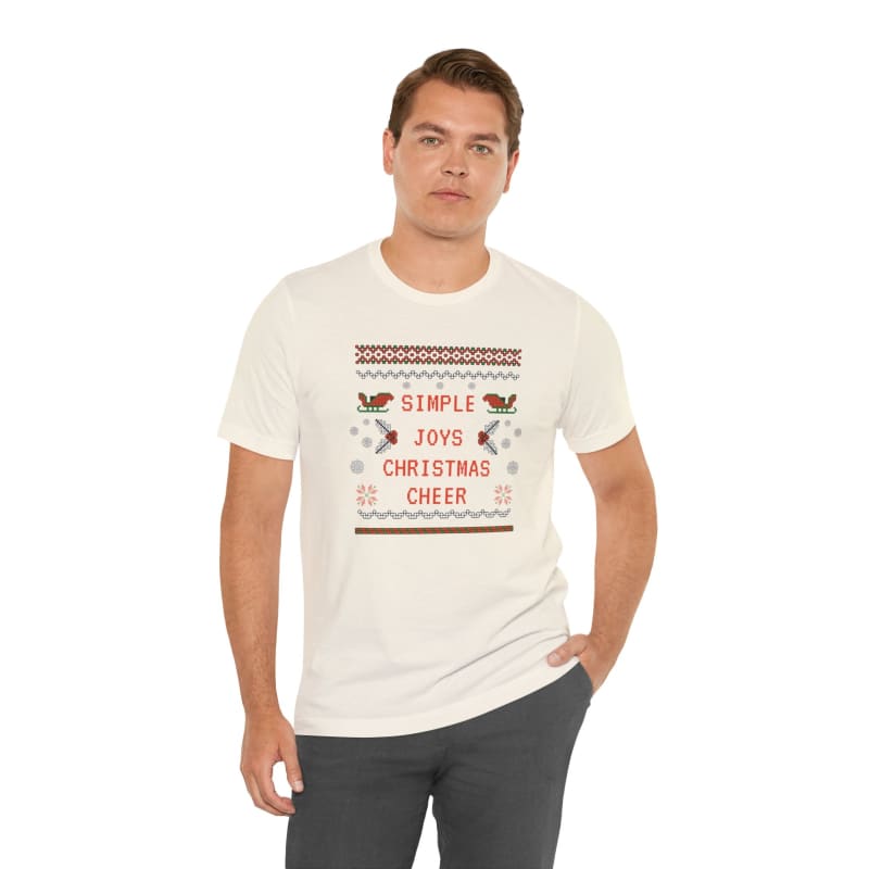 White t-shirt with a festive ’Simple Joys Christmas Cheer’ holiday sweater design.