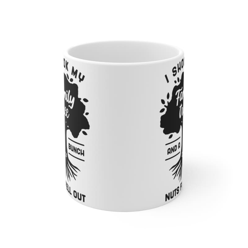 White ceramic mug with black graphic design text and artwork printed on its surface.