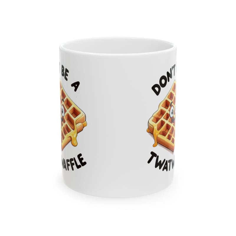 White ceramic mug with waffle illustrations and text printed on it.