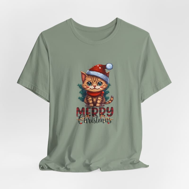 Sage green t-shirt featuring a cartoon kitten wearing a Santa hat and red scarf with ’Merry Christmas’ text.