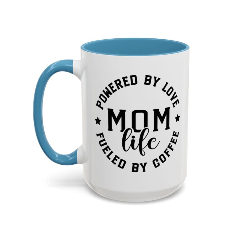 White coffee mug with blue interior and handle featuring black text that reads ’POWERED BY LOVE MOM LIFE FUELED BY COFFEE’