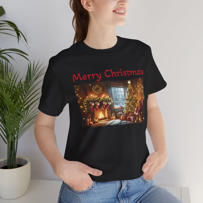 Black t-shirt featuring a cozy Christmas scene with ’Merry Christmas’ text in red lettering.