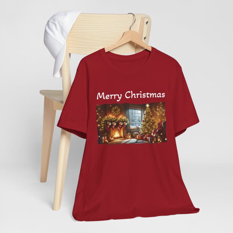 Red t-shirt with a ’Merry Christmas’ message and festive holiday scene printed on the front.