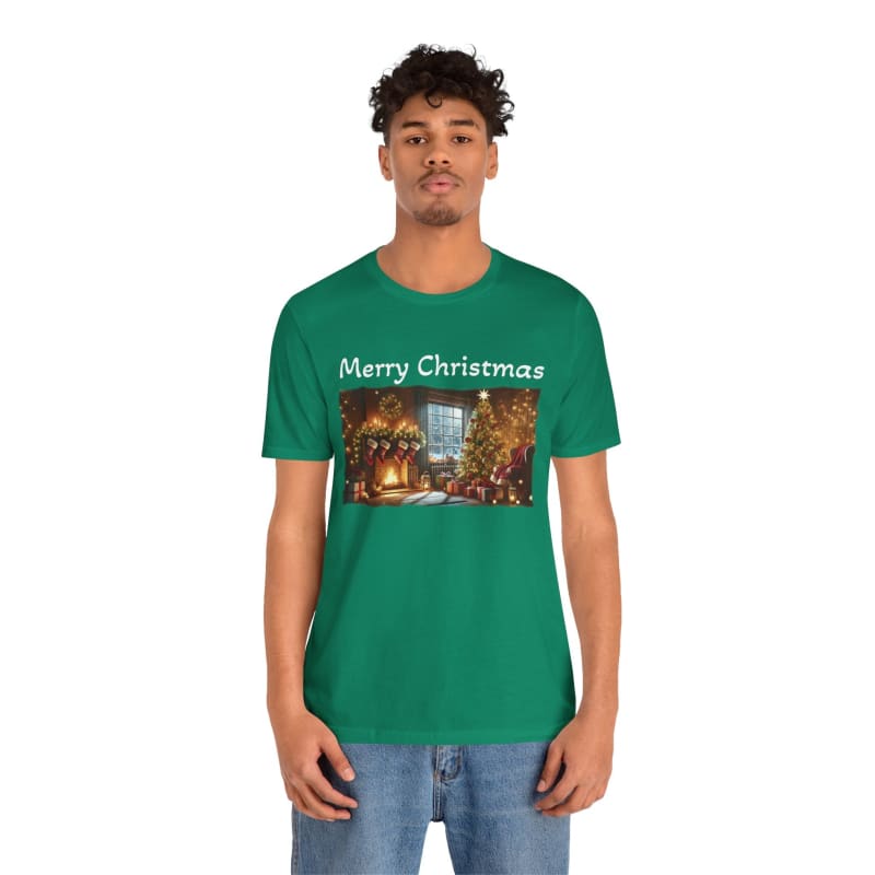 Green t-shirt with ’Merry Christmas’ text and a festive winter scene printed on the front.