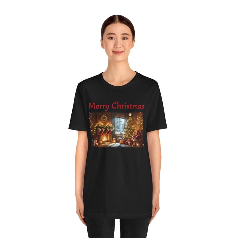 Black t-shirt featuring a festive ’Merry Christmas’ design with an illuminated winter street scene.