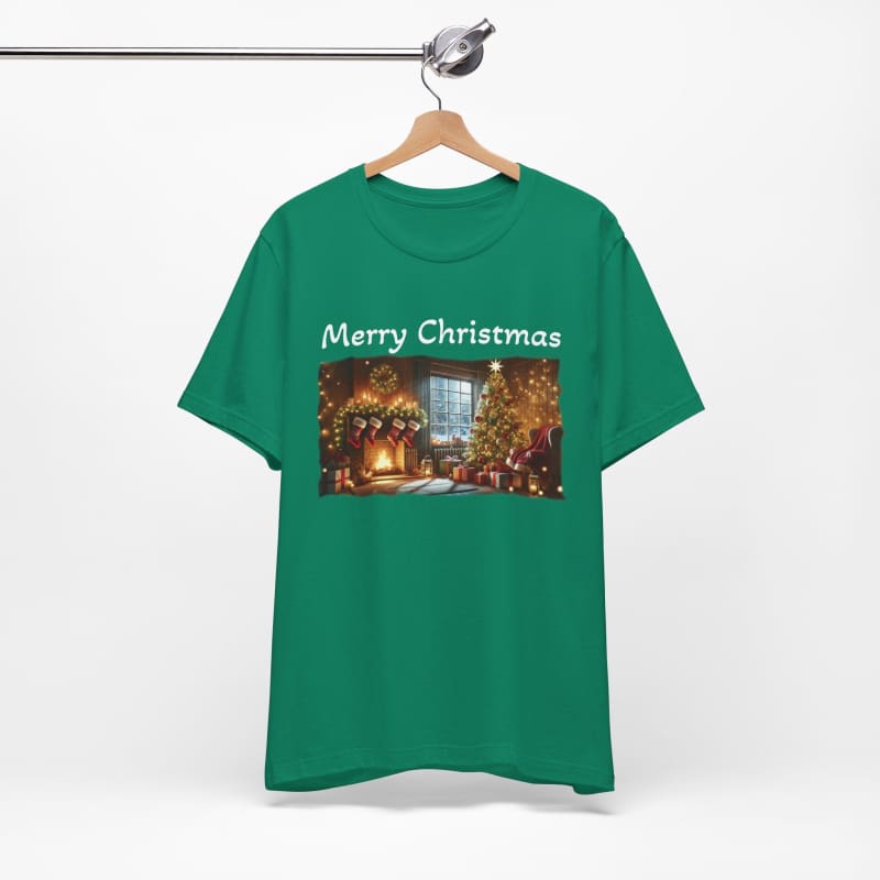 Green t-shirt with ’Merry Christmas’ text and a festive holiday scene printed on the front.