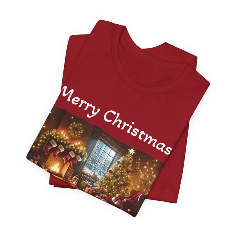 Red t-shirt with ’Merry Christmas’ text and a festive holiday scene printed on it.