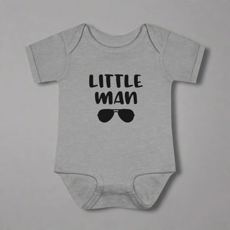 Baby onesie with ’LITTLE MAN’ text and sunglasses graphic printed on it.