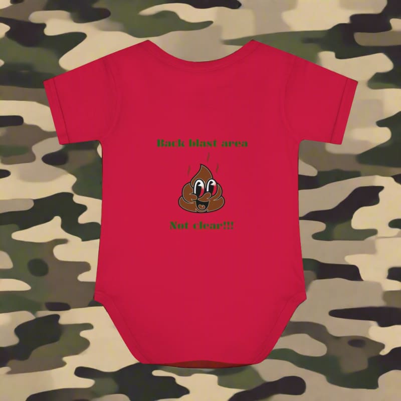 Red baby onesie with a cartoon poop emoji and text printed on it.