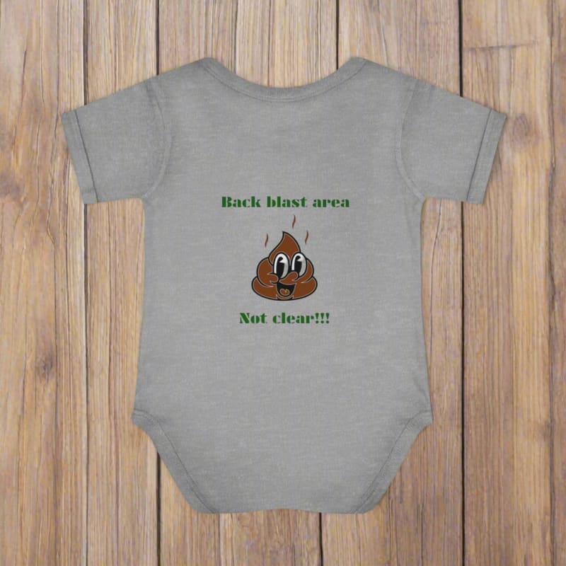 Gray baby onesie with a cartoon poop emoji and humorous text printed on it.