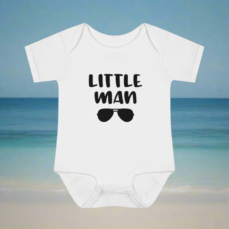 White baby onesie with ’LITTLE MAN’ text and sunglasses graphic printed on the front.