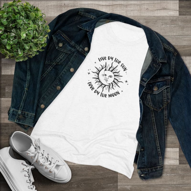 White t-shirt with a sun design and text that reads ’Live by the sun, love by the moon’